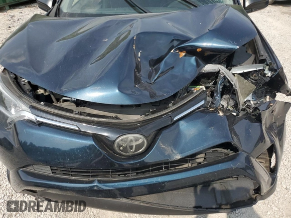 2018 Toyota RAV4 LE with VIN JTMBFREV7JJ253067, listed as a Copart auction lot 60596735 with Not provided miles and Salvage title. Bid and sale history available at DreamBid. Image 12.