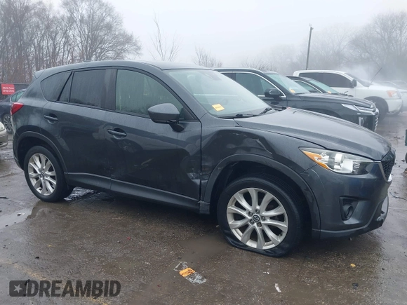 2014 Mazda CX-5 Grand Touring with VIN JM3KE4DY0E0392476, listed as a IAAI auction lot 41419144 with 89,245 mi miles and . Bid and sale history available at carsss.com. Image 13.