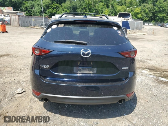 2018 Mazda CX-5 Grand Touring with VIN JM3KFBDM8J0342272, listed as a Copart auction lot 61930115 with 119,727 mi miles and Salvage title. Bid and sale history available at DreamBid. Image 6.