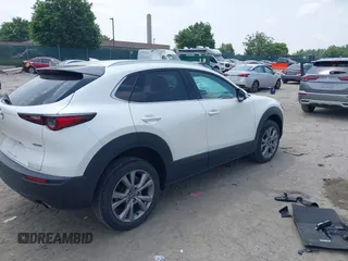 2021 Mazda CX-30 Premium with VIN 3MVDMBDL0MM307045, listed as a IAAI auction lot 42446494 with 33,112 mi miles and . Bid and sale history available at DreamBid. Image 4.