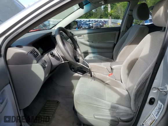 2005 Toyota Corolla CE with VIN 1NXBR32E25Z513898, listed as a Copart auction lot 57679695 with 189,869 mi miles and Salvage title. Bid and sale history available at DreamBid. Image 7.