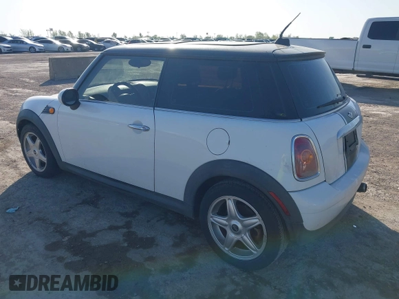 2009 MINI Cooper Hardtop with VIN WMWMF33569TZ20989, listed as a IAAI auction lot 41994772 with 152,944 mi miles. Bid and sale history available at carsss.com. Image 3.