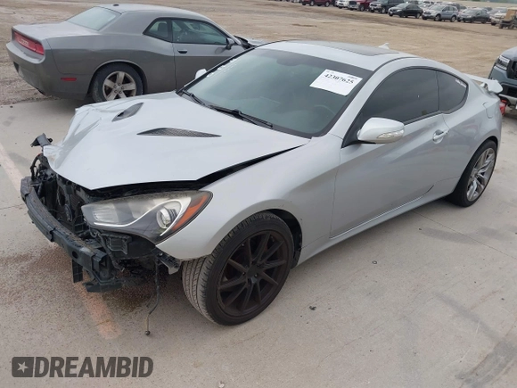 2013 Hyundai Genesis Coupe Track z VIN KMHHU6KJ6DU083587, wystawiony jako IAAI lot #42307625 z przebiegiem 135 247 mil mil oraz . Historia ofert i sprzedaży dostępna na DreamBid. Obrazek 2.