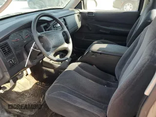 2003 Dodge Dakota with VIN 1D7FL16X13S189963, listed as a Copart auction lot 77114344 with 100,127 mi miles and Salvage Title. Bid and sale history available at carsss.com. Image 8.