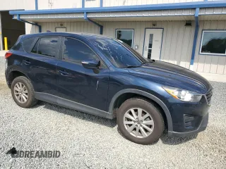 2016 Mazda CX-5 Sport z VIN JM3KE4BY8G0837052, wystawiony jako Copart lot #54700235 z przebiegiem 124 172 mil mil oraz Szkoda całkowita • Salvage title. Historia ofert i sprzedaży dostępna na DreamBid. Obrazek 4.