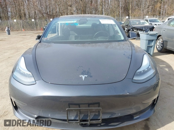 2018 Tesla Model 3 Long Range Battery with VIN 5YJ3E1EB5JF063077, listed as a IAAI auction lot 41773551 with 99,477 mi miles and . Bid and sale history available at DreamBid. Image 12.