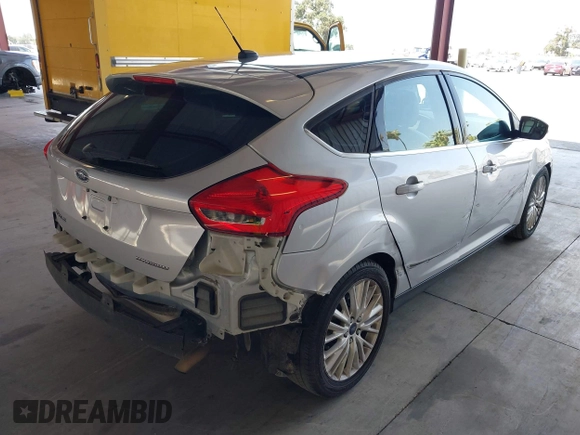 2017 Ford Focus Titanium z VIN 1FADP3N2XHL288103, wystawiony jako IAAI lot #42573844 z przebiegiem 128 952 mil mil oraz . Historia ofert i sprzedaży dostępna na DreamBid. Obrazek 4.
