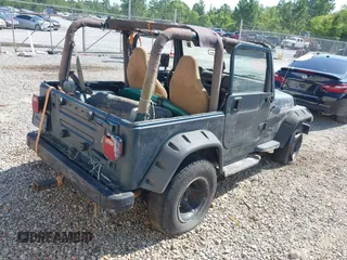1998 Jeep Wrangler Sport with VIN 1J4FY19S2WP710055, listed as a IAAI auction lot 42680216 with Not provided miles and . Bid and sale history available at DreamBid. Image 4.