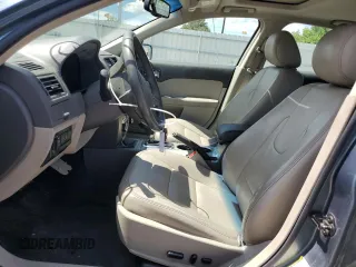 2012 Ford Fusion Hybrid z VIN 3FADP0L3XCR176552, wystawiony jako Copart lot #55787415 z przebiegiem 156 806 mil mil oraz Szkoda całkowita • Salvage title. Historia ofert i sprzedaży dostępna na DreamBid. Obrazek 7.