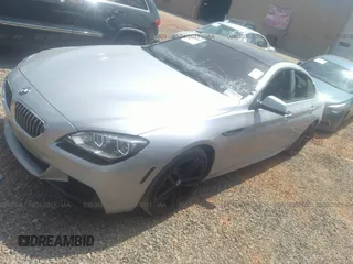 2015 BMW 6 Series 640i z VIN WBA6A0C57FGB53750, wystawiony jako IAAI lot #30357803 z przebiegiem 59 462 mil mil oraz . Historia ofert i sprzedaży dostępna na DreamBid. Obrazek 2.