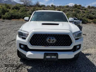 2019 Toyota Tacoma SR z VIN 3TMCZ5AN1KM263494, wystawiony jako Copart lot #54710695 z przebiegiem 57 216 mil mil oraz Szkoda całkowita • Salvage title. Historia ofert i sprzedaży dostępna na DreamBid. Obrazek 5.
