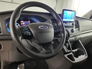 2020 Ford Transit Cargo with VIN 1FTBR2YGXLKA51865, listed as a IAAI auction lot 42229615 with 143,127 mi miles and . Bid and sale history available at carsss.com. Image 23.