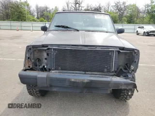 1999 Jeep Cherokee Sport with VIN 1J4FF68S9XL635836, listed as a Copart auction lot 59573195 with 187,035 mi miles and Salvage title. Bid and sale history available at DreamBid. Image 5.