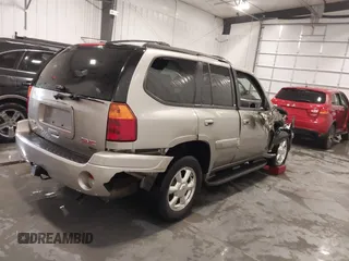 2003 GMC Envoy SLT with VIN 1GKDT13S932395367, listed as a IAAI auction lot 41544810 with 142,012 mi miles. Bid and sale history available at carsss.com. Image 4.