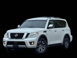 2017 Nissan Armada SV z VIN JN8AY2NC7H95049XX, wystawiony jako Copart lot #61907525 z przebiegiem 131 364 mil mil oraz Czysty tytuł • Clean title. Historia ofert i sprzedaży dostępna na DreamBid. Obrazek 2.