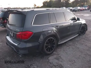 2014 Mercedes-Benz GL-Class GL 550 with VIN 4JGDF7DE9EA329761, listed as a IAAI auction lot 41651533 with 113,056 mi miles. Bid and sale history available at carsss.com. Image 4.