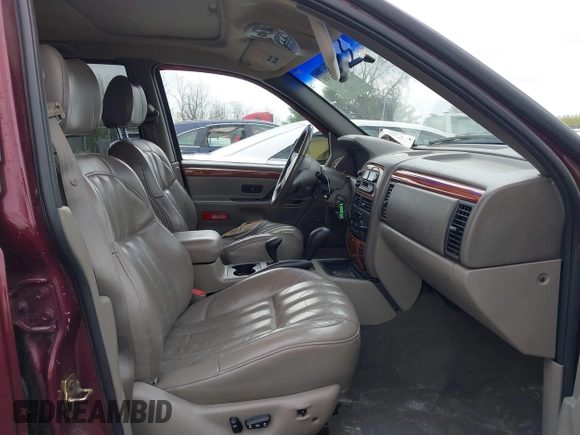 1999 Jeep Grand Cherokee Limited with VIN 1J4GW68N5XC642670, listed as a IAAI auction lot 41990199 with 154,492 mi miles. Bid and sale history available at carsss.com. Image 5.