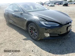 2019 Tesla Model S 100D with VIN 5YJSA1E42KF331240, listed as a Copart auction lot 54713975 with 43,940 mi miles and Salvage title. Bid and sale history available at DreamBid. Image 15.