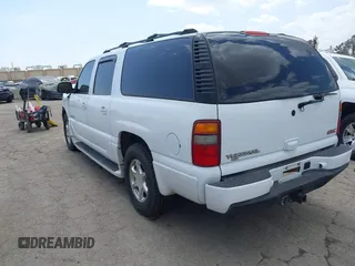 2003 GMC Yukon XL Denali with VIN 1GKFK66UX3J227538, listed as a IAAI auction lot 41915607 with 150,173 mi miles. Bid and sale history available at carsss.com. Image 3.