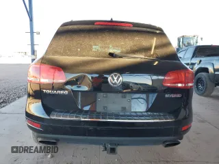 2011 Volkswagen Touareg с VIN WVGFG9BP2BD003056, выставлен на аукционе Copart как лот 84203674 с пробегом 171 456 миль миль и Списание • Salvage title. История ставок и продаж доступна на DreamBid. Изображение 6.