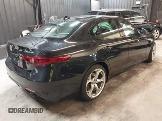2021 Alfa Romeo Giulia Ti z VIN ZARFANBN7M7644482, wystawiony jako IAAI lot #42502199 z przebiegiem 27 962 mil mil oraz . Historia ofert i sprzedaży dostępna na DreamBid. Obrazek 4.
