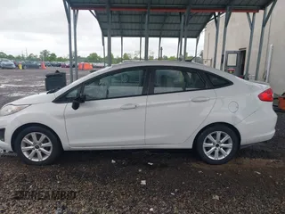 2011 Ford Fiesta SE z VIN 3FADP4BJ5BM207676, wystawiony jako IAAI lot #42263307 z przebiegiem 139 929 mil mil oraz . Historia ofert i sprzedaży dostępna na DreamBid. Obrazek 14.
