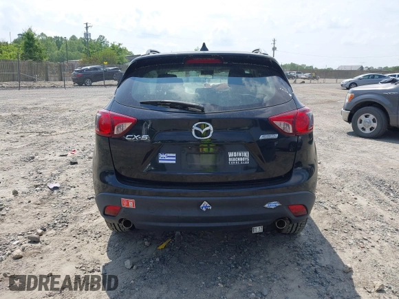 2014 Mazda CX-5 Sport with VIN JM3KE2BE3E0405976, listed as a IAAI auction lot 42161069 with 66,301 mi miles and . Bid and sale history available at carsss.com. Image 16.