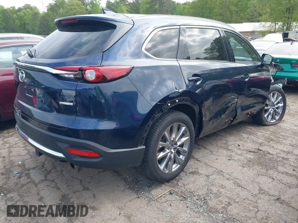 2021 Mazda CX-9 Carbon Edition with VIN JM3TCADY1M0516505, listed as a IAAI auction lot 42016644 with 50,900 mi miles and . Bid and sale history available at carsss.com. Image 4.
