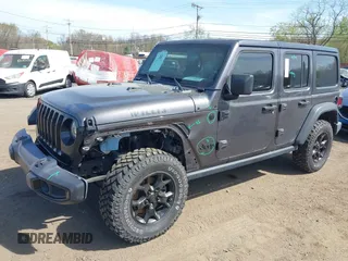 2021 Jeep Wrangler Unlimited Willys with VIN 1C4HJXDG1MW672507, listed as a IAAI auction lot 42084805 with 59,943 mi miles and . Bid and sale history available at DreamBid. Image 6.