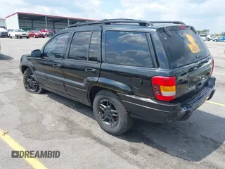 2002 Jeep Grand Cherokee Laredo with VIN 1J4GX48S42C313801, listed as a IAAI auction lot 42297223 with 153,633 mi miles and . Bid and sale history available at DreamBid. Image 3.