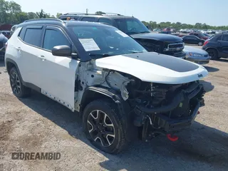 2021 Jeep Compass Trailhawk with VIN 3C4NJDDB7MT564467, listed as a IAAI auction lot 42330939 with 76,963 mi miles and . Bid and sale history available at DreamBid. Image 1.