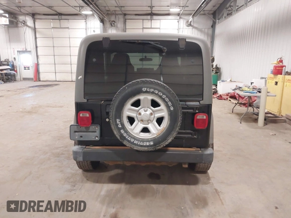 2006 Jeep Wrangler Sport Right Hand Drive with VIN 1J4F449S56P741328, listed as a IAAI auction lot 41476847 with 67,203 mi miles. Bid and sale history available at carsss.com. Image 16.