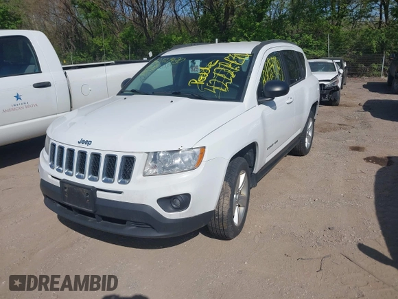 2012 Jeep Compass Latitude with VIN 1C4NJCEA7CD639298, listed as a IAAI auction lot 42121430 with 166,409 mi miles. Bid and sale history available at carsss.com. Image 2.