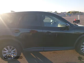 2016 Mazda CX-5 Touring with VIN JM3KE2CY5G0704574, listed as a IAAI auction lot 41033546 with 133,502 mi miles. Bid and sale history available at carsss.com. Image 13.