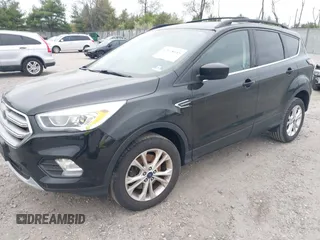 2017 Ford Escape SE with VIN 1FMCU9GD0HUC58128, listed as a IAAI auction lot 42078045 with 125,503 mi miles. Bid and sale history available at carsss.com. Image 2.
