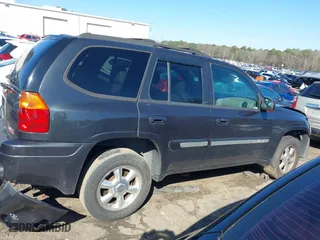 2005 GMC Envoy SLE with VIN 1GKDS13S252305661, listed as a IAAI auction lot 41751800 with 235,090 mi miles. Bid and sale history available at carsss.com. Image 13.