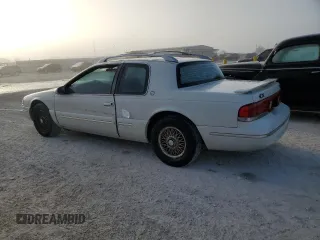 1997 Mercury Cougar z VIN 1MELM62W0VH602622, wystawiony jako Copart lot #77042354 z przebiegiem 122 027 mil mil oraz Nie do naprawy. Historia ofert i sprzedaży dostępna na DreamBid. Obrazek 2.