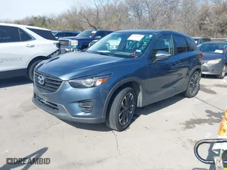 2016 Mazda CX-5 Grand Touring with VIN JM3KE2DYXG0605652, listed as a IAAI auction lot 41789592 with 238,700 mi miles. Bid and sale history available at carsss.com. Image 17.