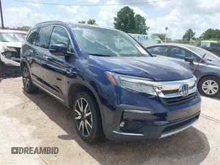 2022 Honda Pilot Touring 7-Passenger with VIN 5FNYF5H61NB019768, listed as a IAAI auction lot 42438780 with Not provided miles and . Bid and sale history available at DreamBid. Image 1.