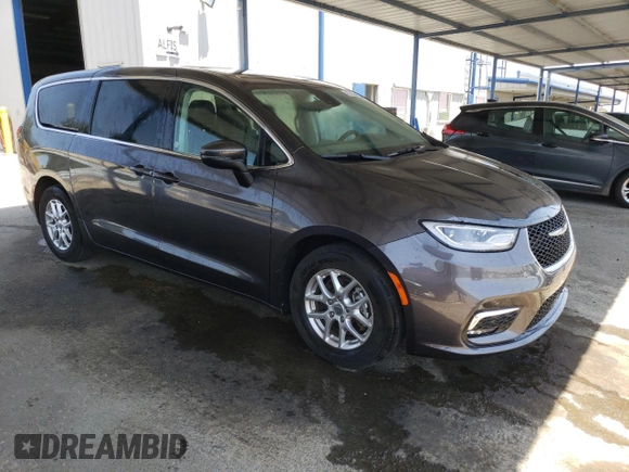 2023 Chrysler Pacifica Touring L with VIN 2C4RC1BG1PR581376, listed as a Copart auction lot 59901915 with 57,411 mi miles and Salvage title. Bid and sale history available at DreamBid. Image 4.