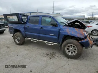 2014 Toyota Tacoma with VIN 5TFLU4EN7EX106909, listed as a Copart auction lot 46906235 with 102,681 mi miles and Salvage Title. Bid and sale history available at DreamBid. Image 4.