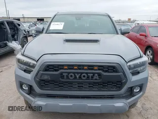 2021 Toyota Tacoma 4WD SR5 with VIN 3TMDZ5BN5MM116584, listed as a IAAI auction lot 41548175 with 23,031 mi miles. Bid and sale history available at carsss.com. Image 6.