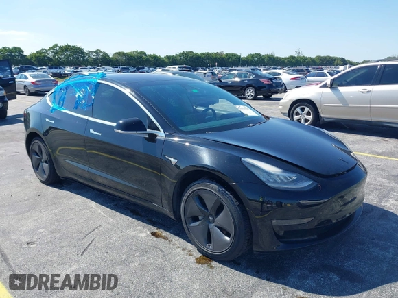 2019 Tesla Model 3 Mid Range with VIN 5YJ3E1EA0KF317058, listed as a IAAI auction lot 42025195 with 108,771 mi miles. Bid and sale history available at carsss.com. Image 1.