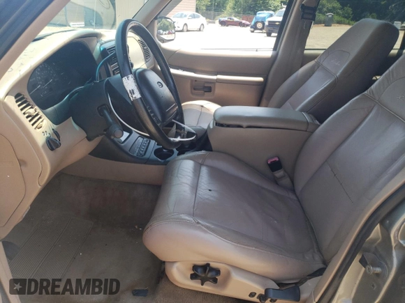 1999 Ford Explorer XLT z VIN 1FMZU32E4XUB76005, wystawiony jako Copart lot #65391564 z przebiegiem 245 873 mil mil oraz Szkoda całkowita • Salvage title. Historia ofert i sprzedaży dostępna na DreamBid. Obrazek 7.