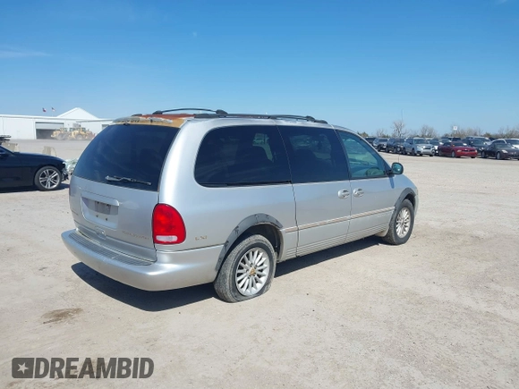 1999 Chrysler Town & Country LXi with VIN 1C4GP54L9XB872347, listed as a IAAI auction lot 41611666 with 224,817 mi miles. Bid and sale history available at carsss.com. Image 6.
