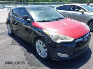 2012 Hyundai Veloster w/Gray Int z VIN KMHTC6AD4CU070537, wystawiony jako IAAI lot #42202272 z przebiegiem 120 054 mil mil oraz . Historia ofert i sprzedaży dostępna na DreamBid. Obrazek 1.