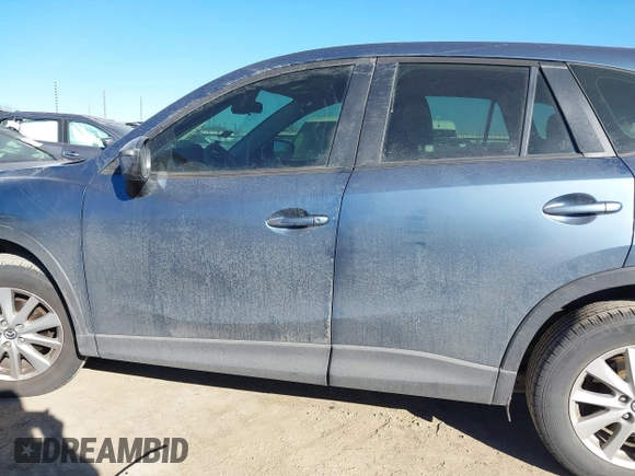 2016 Mazda CX-5 Sport with VIN JM3KE2BY3G0641895, listed as a IAAI auction lot 41689138 with 121,636 mi miles and . Bid and sale history available at DreamBid. Image 15.