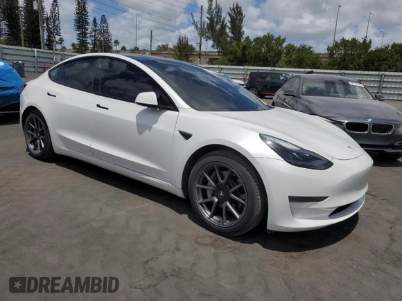 2021 Tesla Model 3 Standard Range Plus with VIN 5YJ3E1EA2MF985463, listed as a Copart auction lot 53311455 with 23,176 mi miles and Clean Title. Bid and sale history available at DreamBid. Image 4.