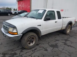 1999 Ford Ranger XLT with VIN 1FTZR15XXXTA09502, listed as a IAAI auction lot 41794904 with 203,276 mi miles. Bid and sale history available at carsss.com. Image 2.