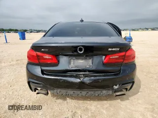 2018 BMW 5 Series 540i xDrive with VIN WBAJE7C52JWD52730, listed as a Copart auction lot 60297425 with 104,208 mi miles and Salvage title. Bid and sale history available at DreamBid. Image 6.